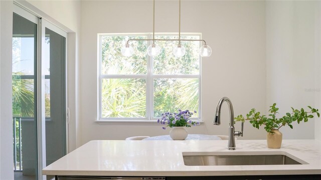 455 Riverfront Dr Unit A203, Palm Coast, FL 32137 - kitchen with light countertops and pendant lighting