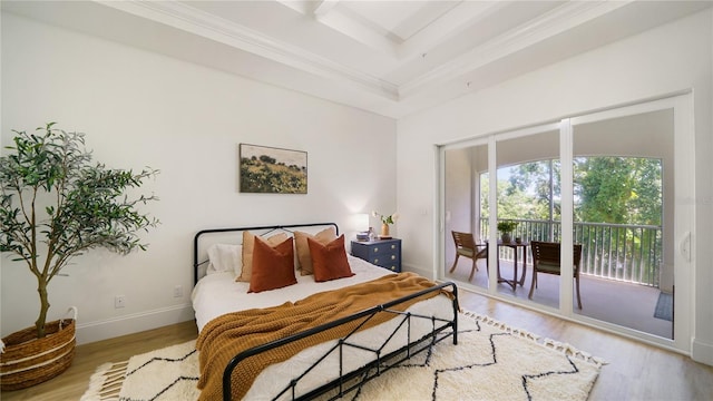 455 Riverfront Dr Unit A203, Palm Coast, FL 32137 - bedroom featuring access to outside, light wood finished floors, and ornamental molding