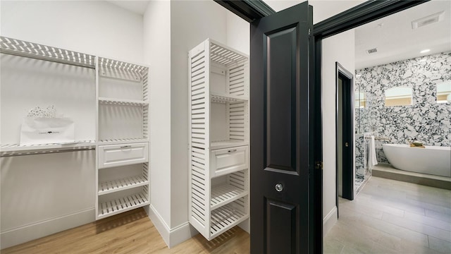 455 Riverfront Dr Unit A203, Palm Coast, FL 32137 - spacious closet featuring light wood-style flooring