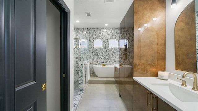 455 Riverfront Dr Unit A203, Palm Coast, FL 32137 - full bathroom featuring vanity, a soaking tub, and tile patterned flooring