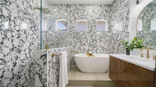 455 Riverfront Dr Unit A203, Palm Coast, FL 32137 - full bath featuring vanity, a marble finish shower, and a soaking tub