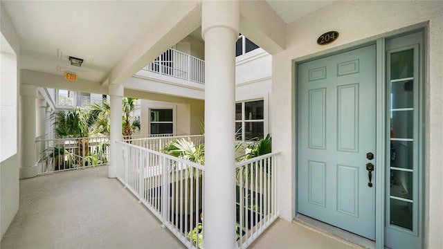 455 Riverfront Dr Unit A204, Palm Coast, FL 32137 - view of exterior entry with a balcony