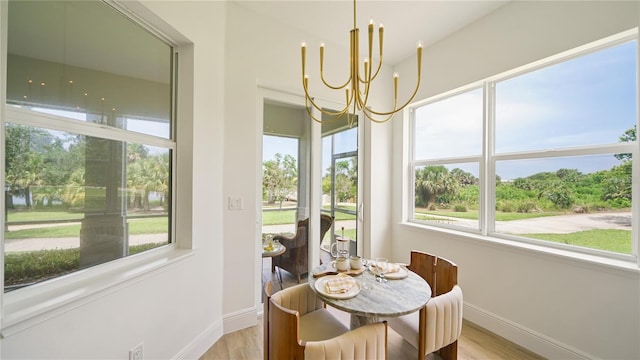 455 Riverfront Dr Unit A204, Palm Coast, FL 32137 - dining area featuring a chandelier and light wood-style flooring