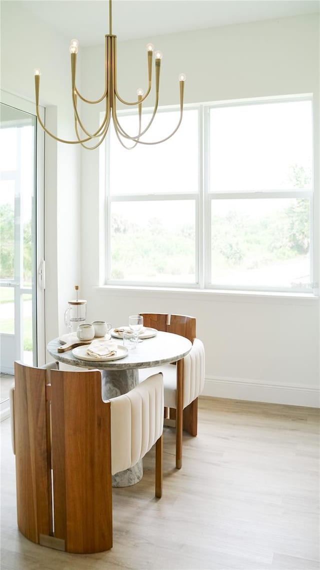455 Riverfront Dr Unit A204, Palm Coast, FL 32137 - dining space with a chandelier and light wood-type flooring