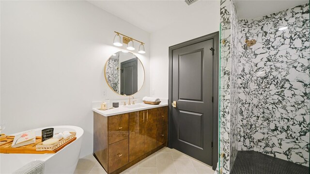 455 Riverfront Dr Unit A204, Palm Coast, FL 32137 - bathroom featuring vanity, a stall shower, tile patterned flooring, and a freestanding bath