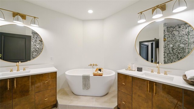 455 Riverfront Dr Unit A204, Palm Coast, FL 32137 - full bathroom featuring two vanities, tile patterned floors, and a soaking tub