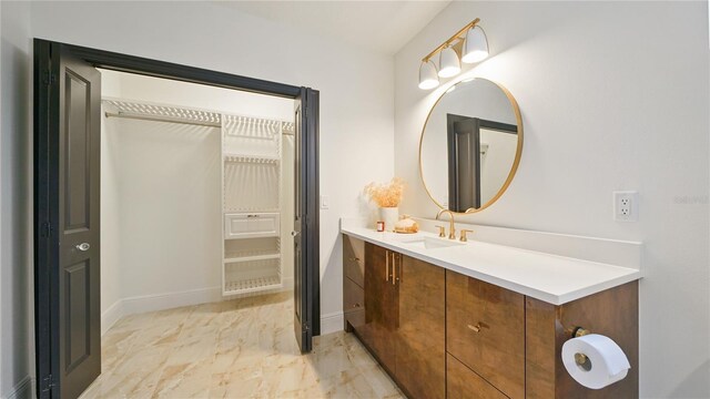 455 Riverfront Dr Unit A204, Palm Coast, FL 32137 - bathroom featuring marble finish flooring and vanity