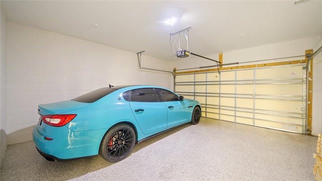 455 Riverfront Dr Unit A204, Palm Coast, FL 32137 - garage with a garage door opener and concrete block wall