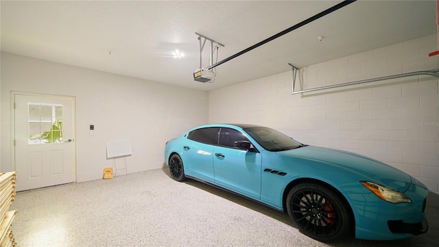 455 Riverfront Dr Unit A204, Palm Coast, FL 32137 - garage with a garage door opener and concrete block wall