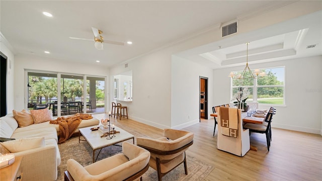 455 Riverfront Dr Unit A301, Palm Coast, FL 32137 - living room featuring a ceiling fan, ornamental molding, light wood-style flooring, recessed lighting, and a chandelier