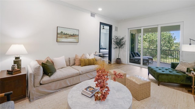 455 Riverfront Dr Unit A302, Palm Coast, FL 32137 - living room with crown molding, light wood-style flooring, and recessed lighting