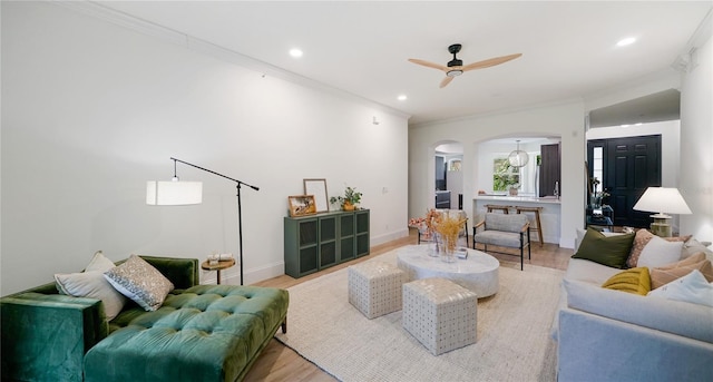 455 Riverfront Dr Unit A302, Palm Coast, FL 32137 - living area with arched walkways, ceiling fan, crown molding, light wood finished floors, and recessed lighting