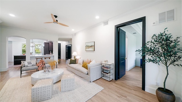 455 Riverfront Dr Unit A302, Palm Coast, FL 32137 - living area with a ceiling fan, arched walkways, crown molding, light wood-style floors, and recessed lighting