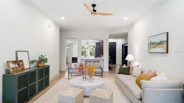 455 Riverfront Dr Unit A302, Palm Coast, FL 32137 - living area featuring arched walkways, a ceiling fan, light wood-style flooring, ornamental molding, and recessed lighting