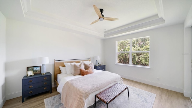 455 Riverfront Dr Unit A302, Palm Coast, FL 32137 - bedroom featuring a tray ceiling, light wood-style floors, and ceiling fan