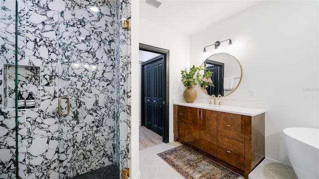 455 Riverfront Dr Unit A302, Palm Coast, FL 32137 - bathroom featuring vanity, a stall shower, tile patterned floors, and a freestanding bath