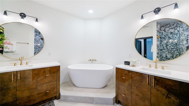 455 Riverfront Dr Unit A302, Palm Coast, FL 32137 - full bath featuring two vanities, a freestanding tub, and tile patterned floors