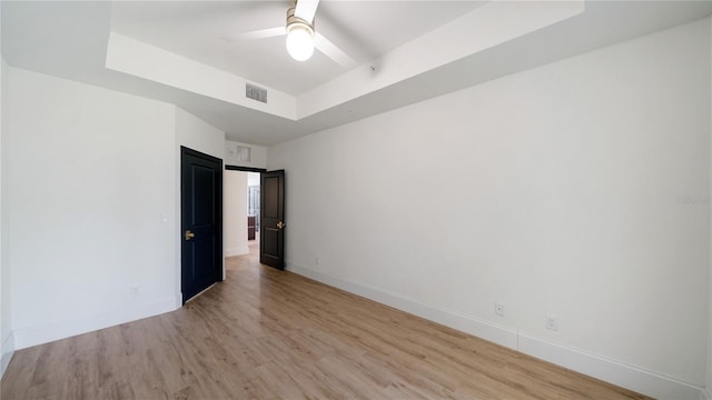 455 Riverfront Dr Unit A302, Palm Coast, FL 32137 - spare room with a raised ceiling, light wood-type flooring, and a ceiling fan