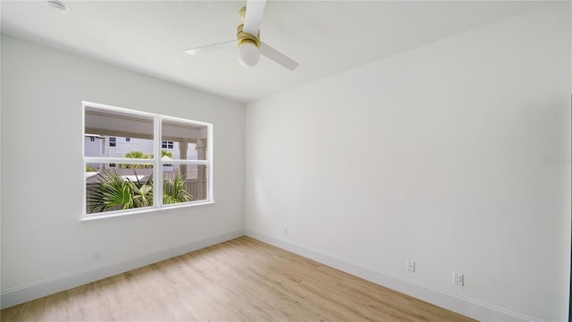 455 Riverfront Dr Unit A302, Palm Coast, FL 32137 - unfurnished room with light wood-style floors, a ceiling fan, and a smoke detector
