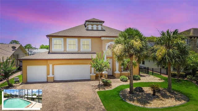 30 Cortes Ct, Palm Coast, FL 32137 - view of front of property featuring stucco siding, a shingled roof, decorative driveway, and a garage