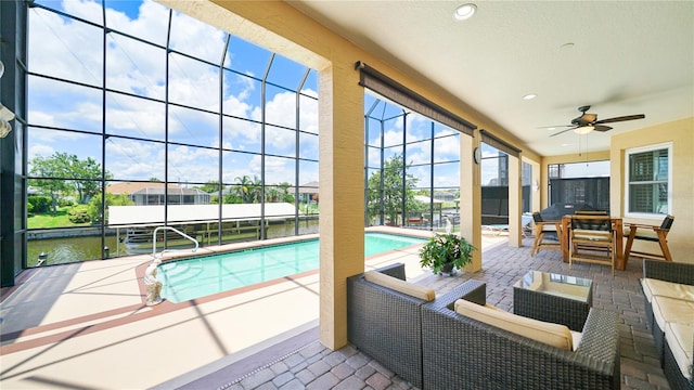 30 Cortes Ct, Palm Coast, FL 32137 - outdoor pool with a patio, a ceiling fan, glass enclosure, and outdoor lounge area