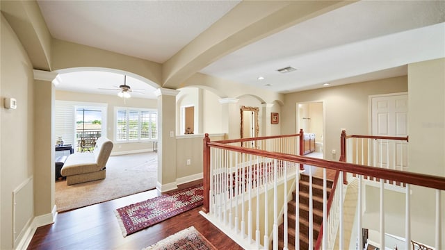 30 Cortes Ct, Palm Coast, FL 32137 - hallway with an upstairs landing, wood finished floors, recessed lighting, and arched walkways