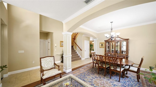 30 Cortes Ct, Palm Coast, FL 32137 - tiled dining space with ornate columns, arched walkways, a chandelier, ornamental molding, and stairway