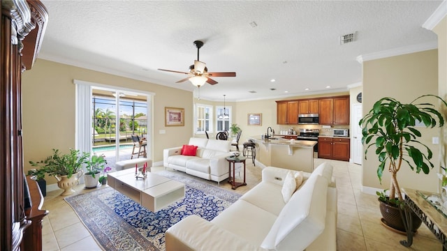 30 Cortes Ct, Palm Coast, FL 32137 - living room featuring ceiling fan, ornamental molding, light tile patterned floors, recessed lighting, and a textured ceiling