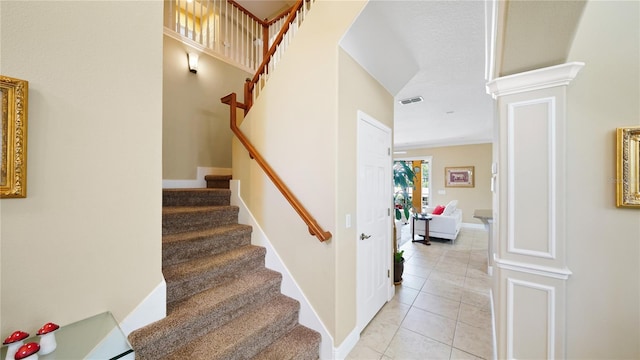 30 Cortes Ct, Palm Coast, FL 32137 - stairway featuring tile patterned floors and decorative columns