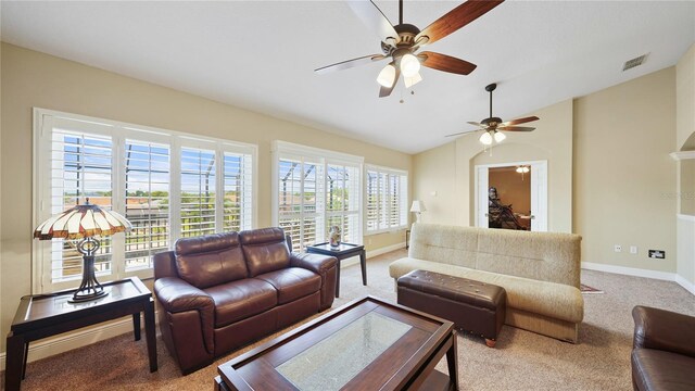 30 Cortes Ct, Palm Coast, FL 32137 - carpeted living room featuring a ceiling fan and lofted ceiling