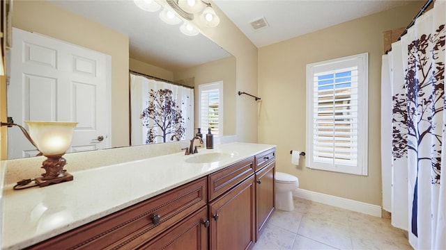 30 Cortes Ct, Palm Coast, FL 32137 - bathroom featuring vanity, plenty of natural light, tile patterned floors, and a shower with curtain