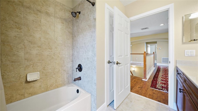 30 Cortes Ct, Palm Coast, FL 32137 - full bath featuring vanity, washtub / shower combination, and tile patterned floors