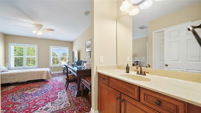 30 Cortes Ct, Palm Coast, FL 32137 - bathroom with vanity, ensuite bathroom, and a ceiling fan