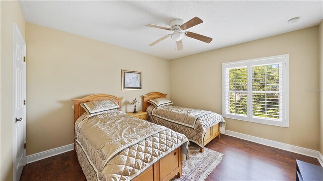 30 Cortes Ct, Palm Coast, FL 32137 - bedroom with dark wood finished floors and a ceiling fan