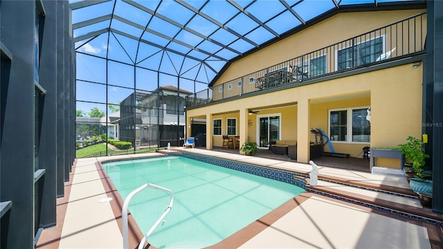 30 Cortes Ct, Palm Coast, FL 32137 - swimming pool featuring a patio, an outdoor hangout area, ceiling fan, and glass enclosure
