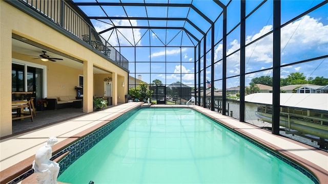 30 Cortes Ct, Palm Coast, FL 32137 - outdoor pool featuring glass enclosure, a patio, and a water view
