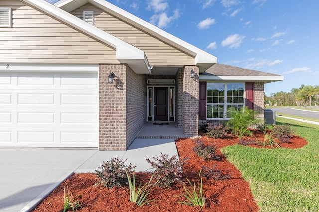 88 Rae Dr, Palm Coast, FL 32164 - doorway to property featuring brick siding, an attached garage, and concrete driveway
