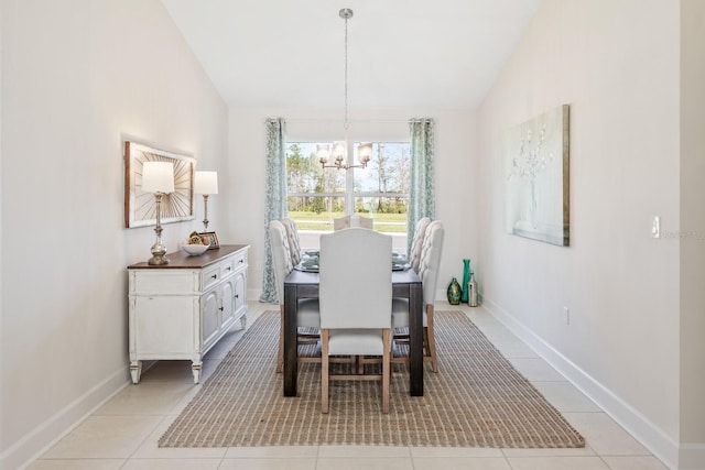 88 Rae Dr, Palm Coast, FL 32164 - dining area featuring a chandelier, lofted ceiling, and light tile patterned flooring
