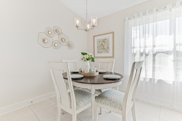 88 Rae Dr, Palm Coast, FL 32164 - dining area with light tile patterned flooring and a chandelier
