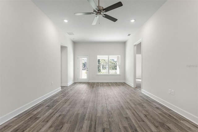 12 Wainshire Pl, Palm Coast, FL 32164 - unfurnished living room featuring dark wood-style flooring, ceiling fan, and recessed lighting