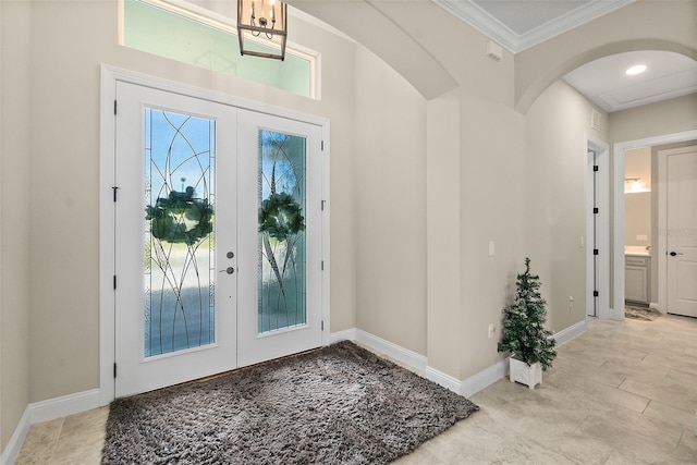 67 N Lakewalk Dr, Palm Coast, FL 32137 - entryway with french doors, ornamental molding, and arched walkways