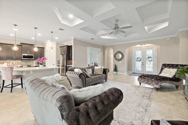 67 N Lakewalk Dr, Palm Coast, FL 32137 - living room featuring arched walkways, ornamental molding, coffered ceiling, recessed lighting, and beamed ceiling