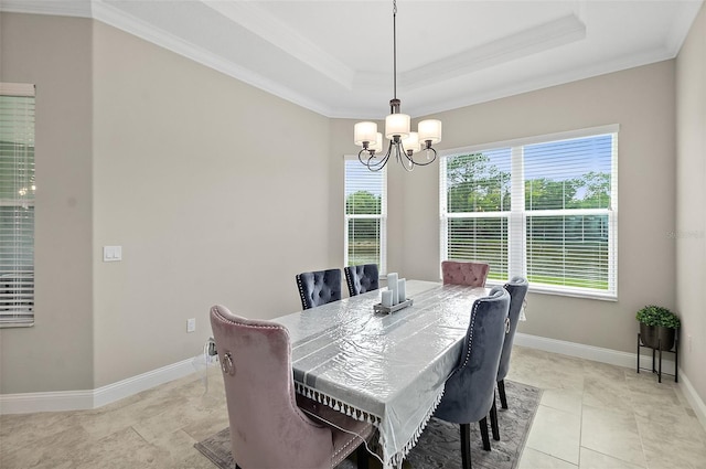 67 N Lakewalk Dr, Palm Coast, FL 32137 - dining room with a chandelier, crown molding, light tile patterned flooring, and a raised ceiling