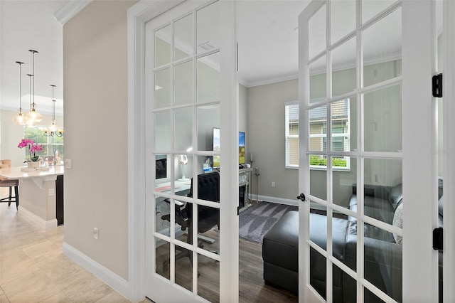 67 N Lakewalk Dr, Palm Coast, FL 32137 - entryway with a desk, crown molding, and a chandelier