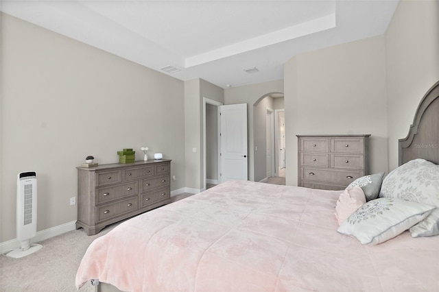 67 N Lakewalk Dr, Palm Coast, FL 32137 - carpeted bedroom with arched walkways and baseboards