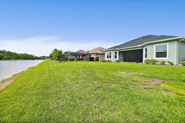 67 N Lakewalk Dr, Palm Coast, FL 32137 - view of green lawn with a sunroom and a water view