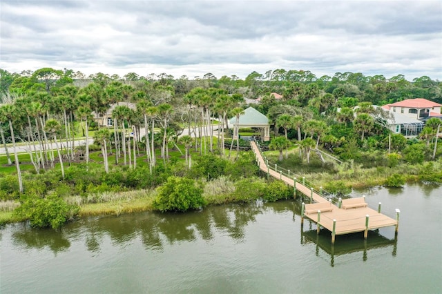 67 N Lakewalk Dr, Palm Coast, FL 32137 - dock area featuring a water view and view of scattered trees