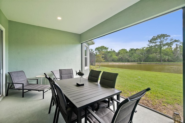 67 N Lakewalk Dr, Palm Coast, FL 32137 - view of patio / terrace featuring a water view and outdoor dining space