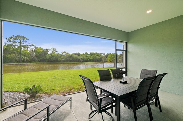 67 N Lakewalk Dr, Palm Coast, FL 32137 - view of patio / terrace with a water view and outdoor dining space