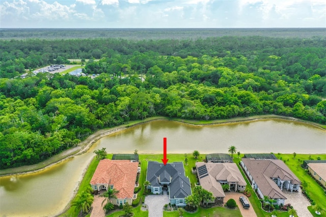 67 N Lakewalk Dr, Palm Coast, FL 32137 - aerial perspective of suburban area with a forest and a large body of water